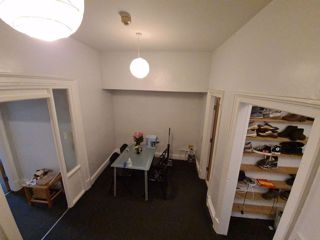 A modest communal workspace featuring a central...