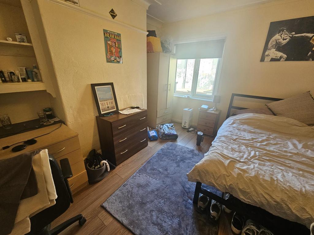 Bright and cozy double bedroom featuring a comf...