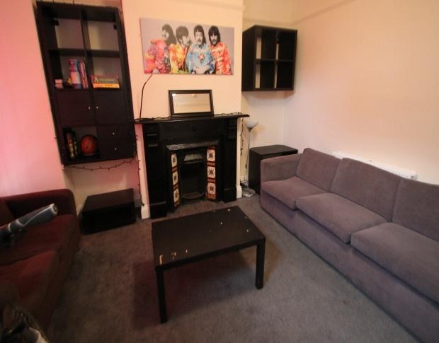 A cozy living room featuring a comfortable sofa...