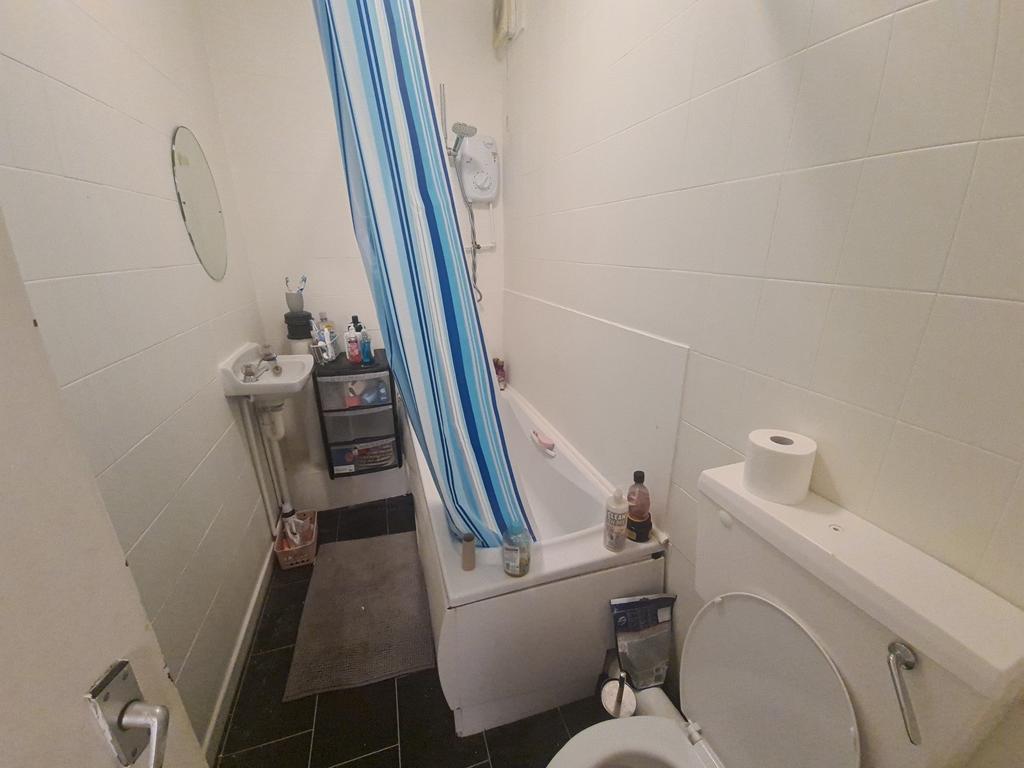 A clean and functional bathroom featuring a bat...