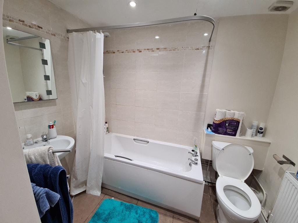 Bright and clean bathroom featuring a spacious ...