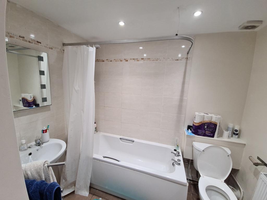 A clean and well-maintained bathroom featuring ...