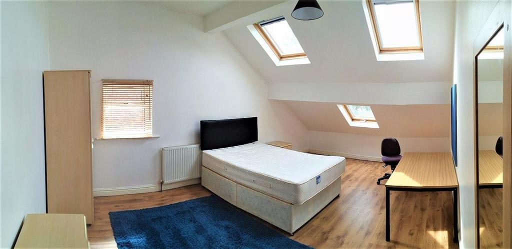 Bright and airy master bedroom featuring a doub...