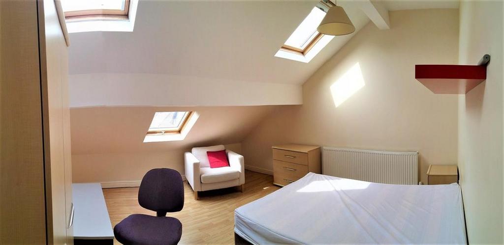 A bright and spacious master bedroom featuring ...