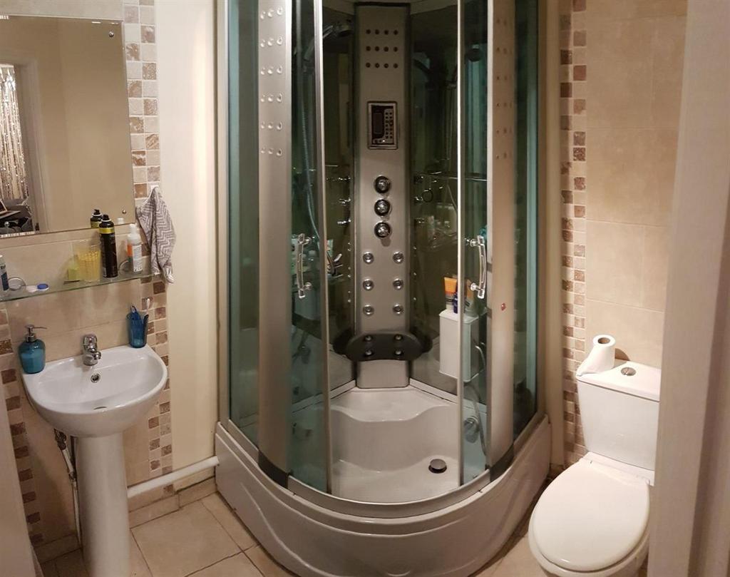 A clean and modern bathroom featuring a contemp...
