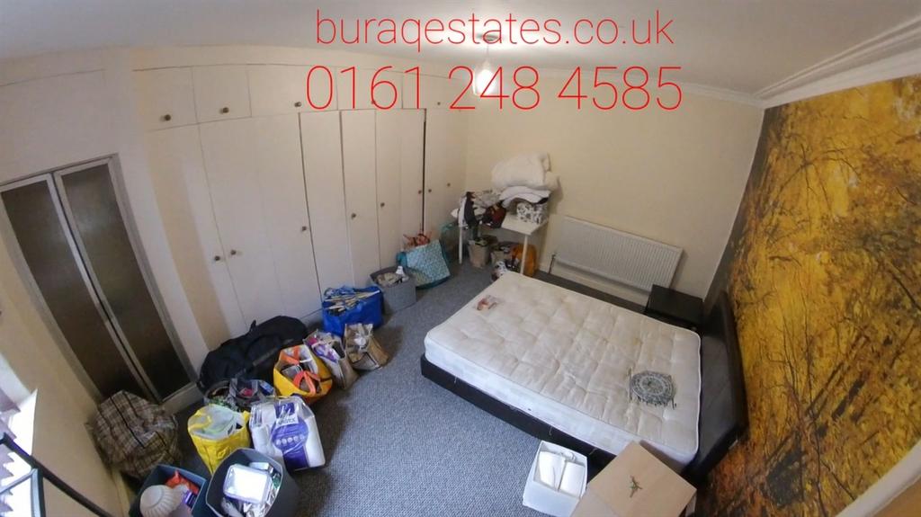 A double bedroom featuring a large built-in war...