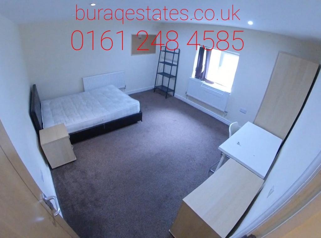 A neat single bedroom featuring a comfortable b...