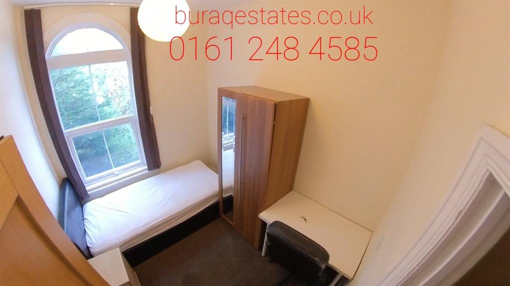 Bright and compact student room featuring a nea...