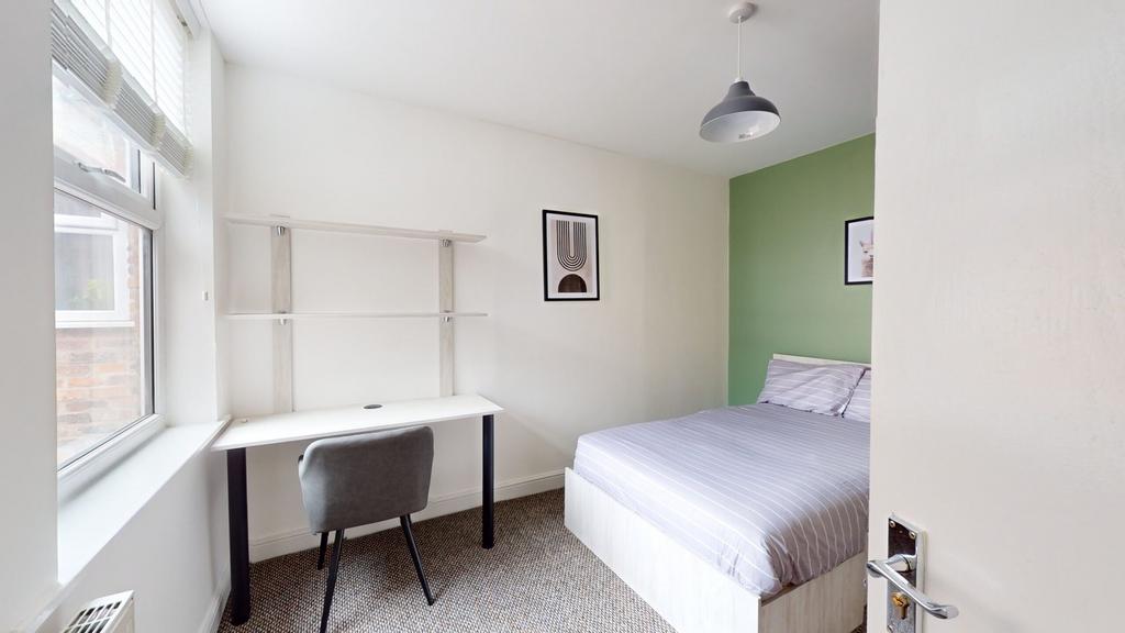 A bright and modern double bedroom featuring a ...
