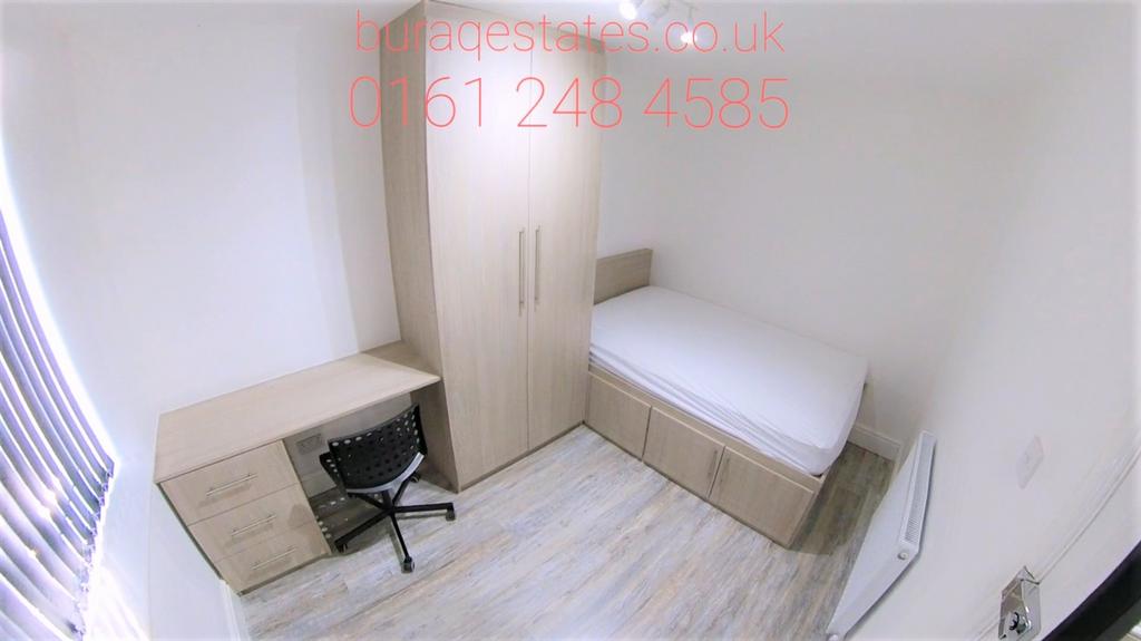 A bright and tidy single bedroom featuring a si...