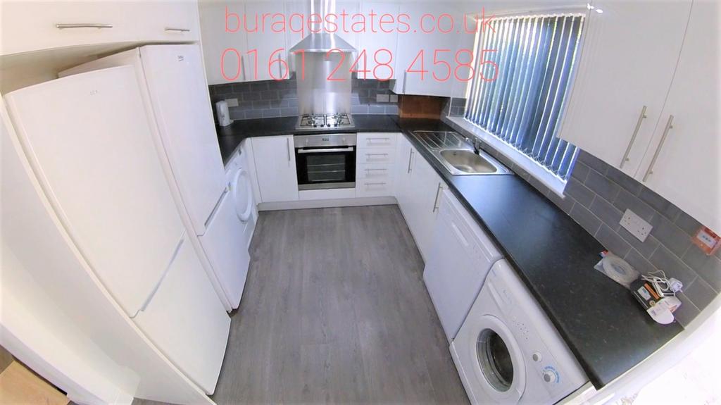 Bright and modern kitchen featuring a full set ...