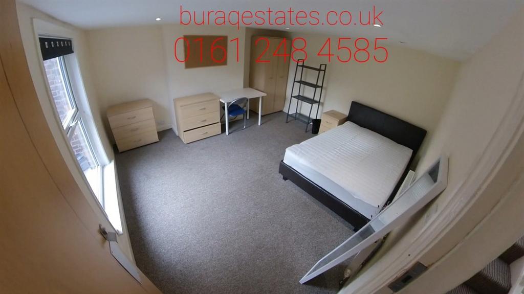 Bright and spacious master bedroom featuring a ...