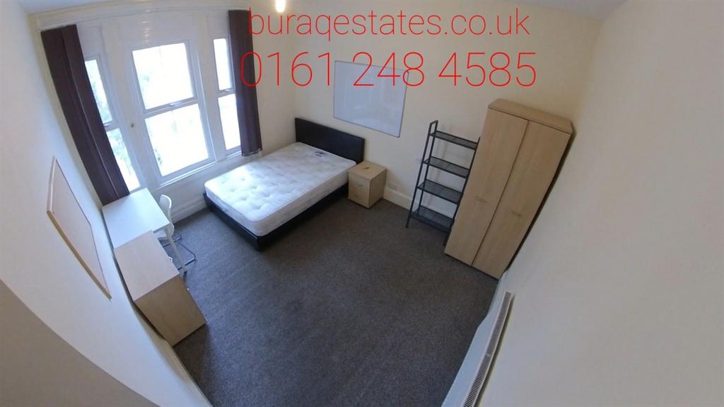 Bright and tidy double bedroom featuring a larg...