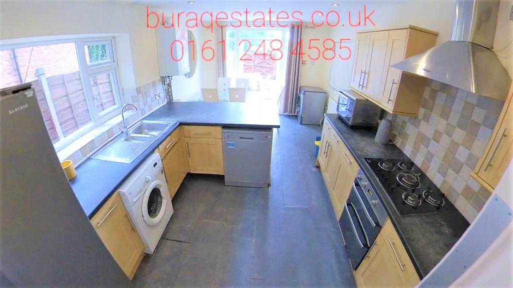 Bright and modern kitchen featuring ample natur...