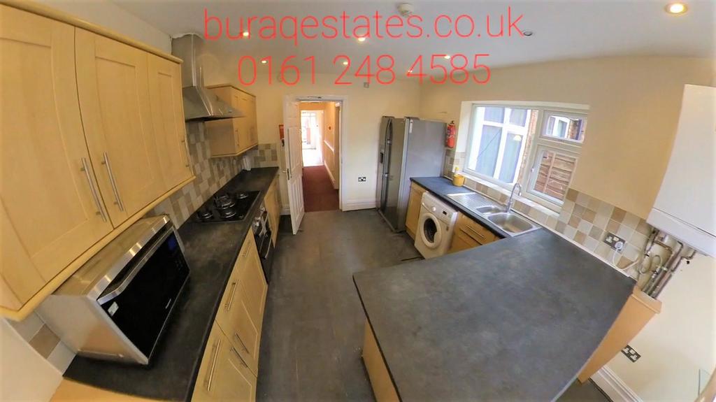 A modern, well-maintained kitchen featuring amp...