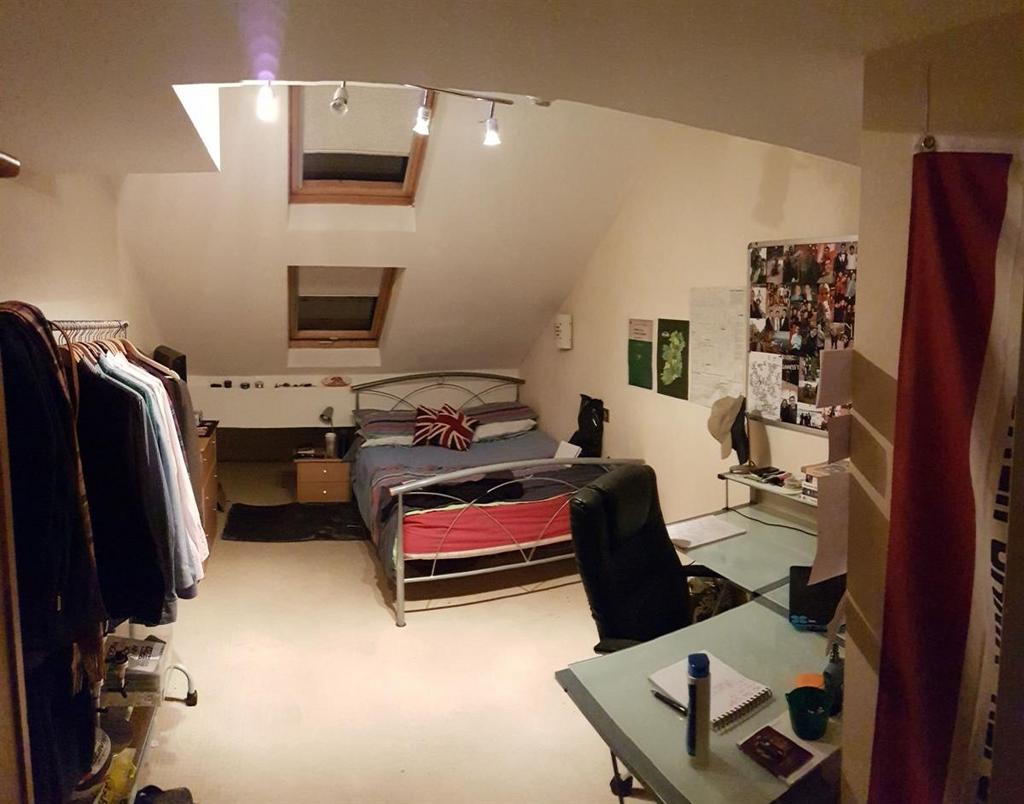 Spacious attic master bedroom featuring a doubl...