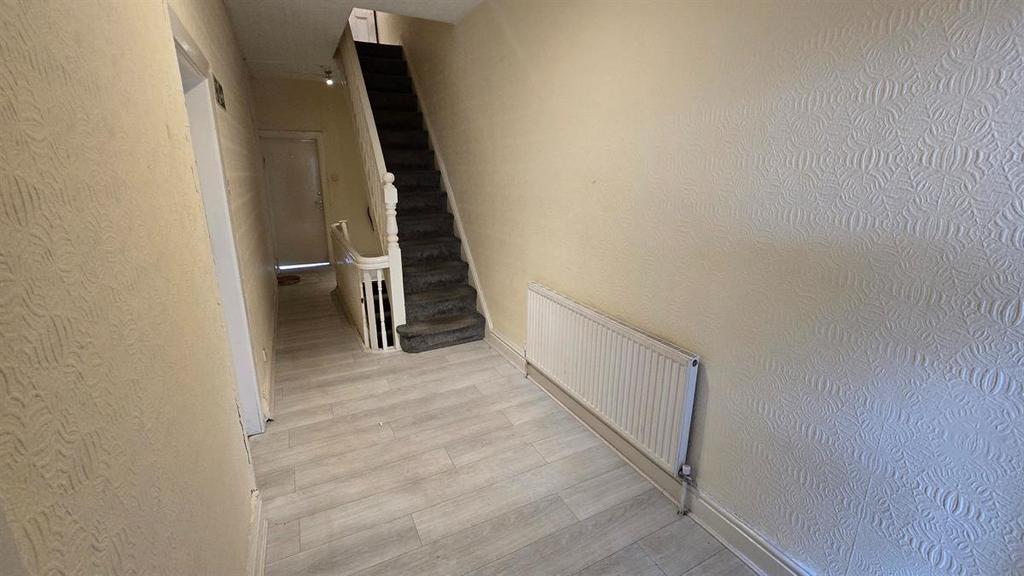 A clean and well-maintained hallway with light ...