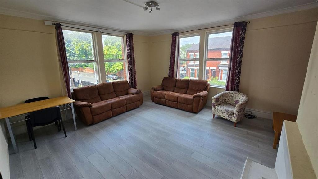 Bright and welcoming living room featuring larg...