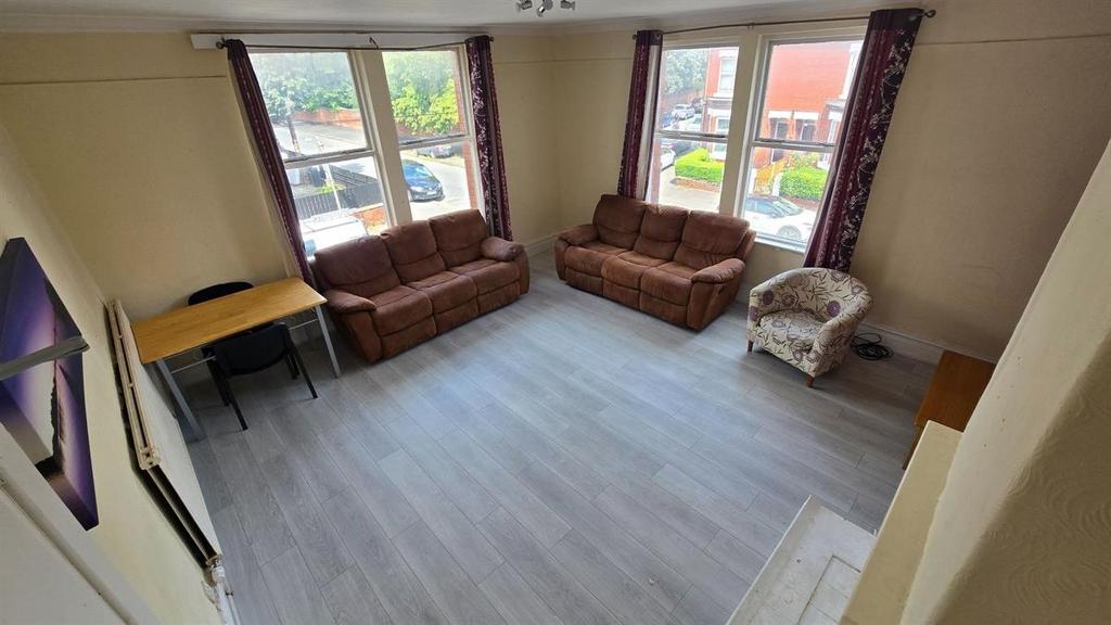 Bright and welcoming living room featuring two ...