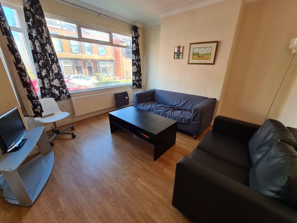 A cozy and well-maintained living room featurin...