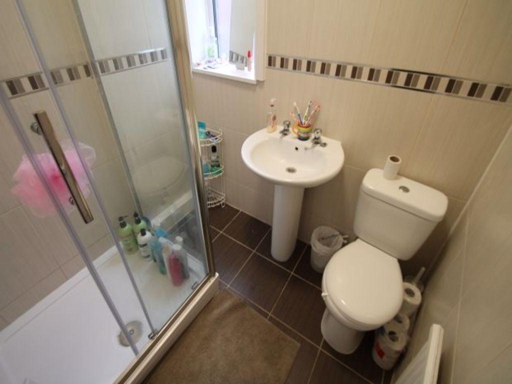 Bright and modern bathroom featuring a spacious...