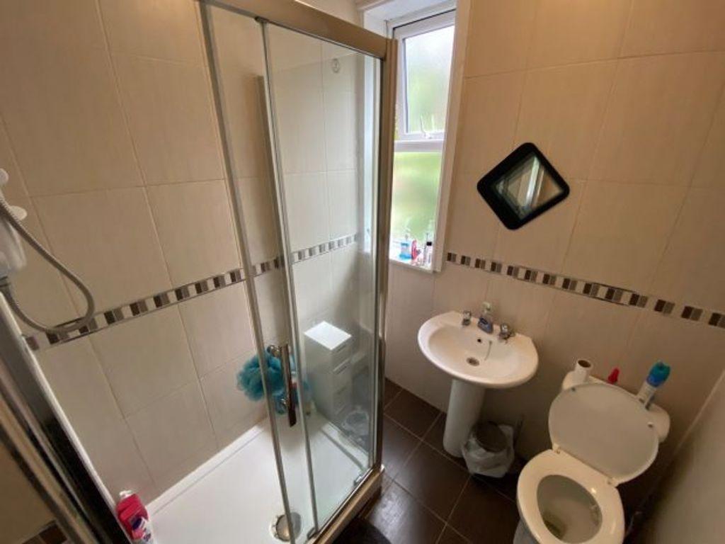 A clean and well-maintained bathroom featuring ...