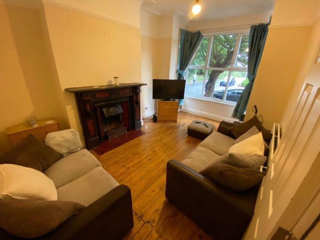 A cozy and inviting living room featuring comfo...