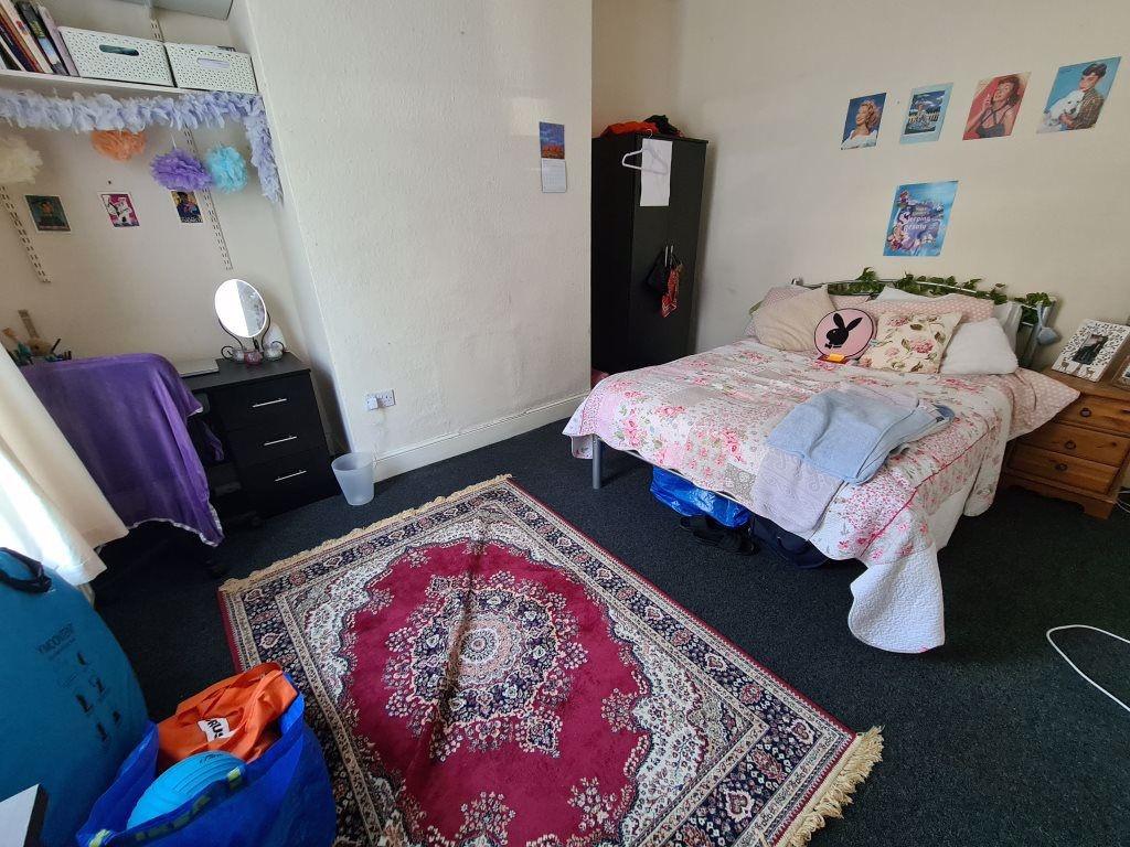A spacious and well-maintained master bedroom f...
