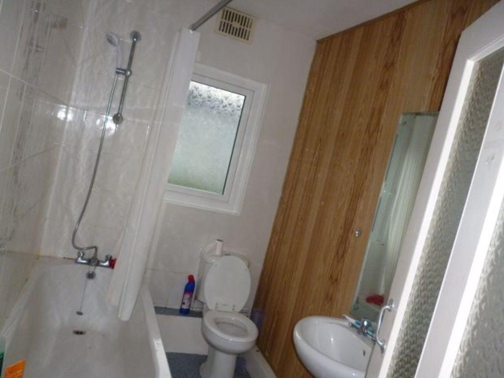A well-maintained bathroom featuring a bathtub,...