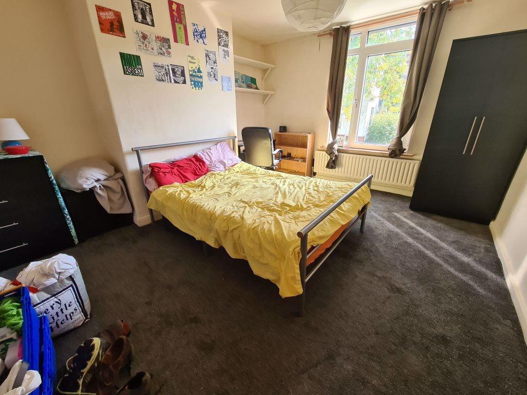 Spacious and well-lit master bedroom featuring ...