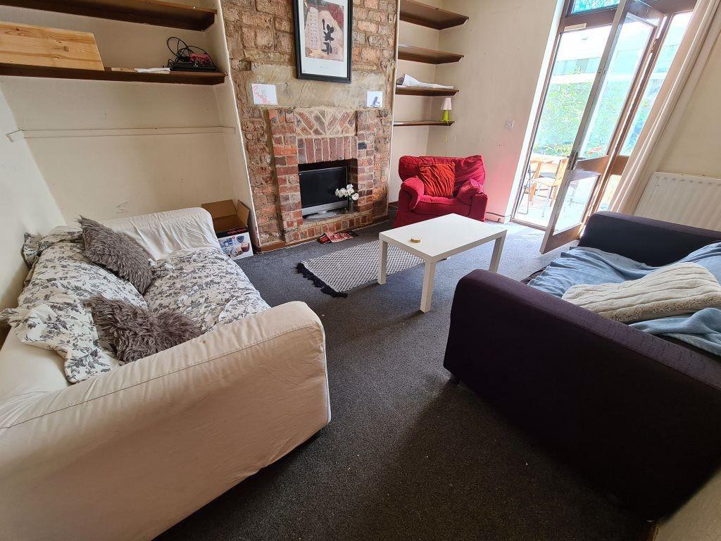 A spacious and inviting living room featuring c...