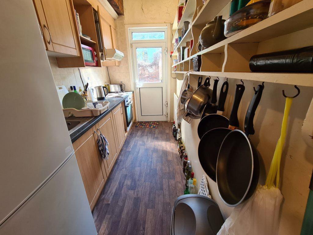 A bright and well-organized kitchen area with a...