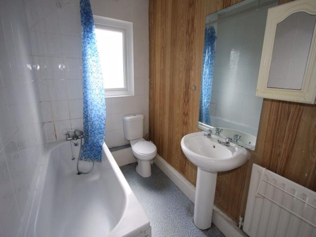 A spacious and clean bathroom featuring a large...