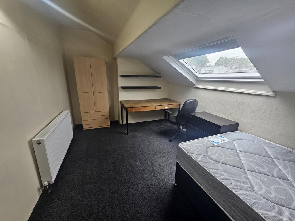 A bright and neatly maintained student bedroom ...