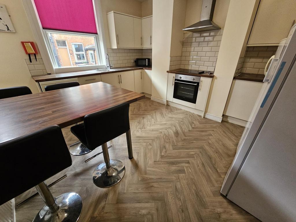 A well-maintained kitchen area featuring modern...