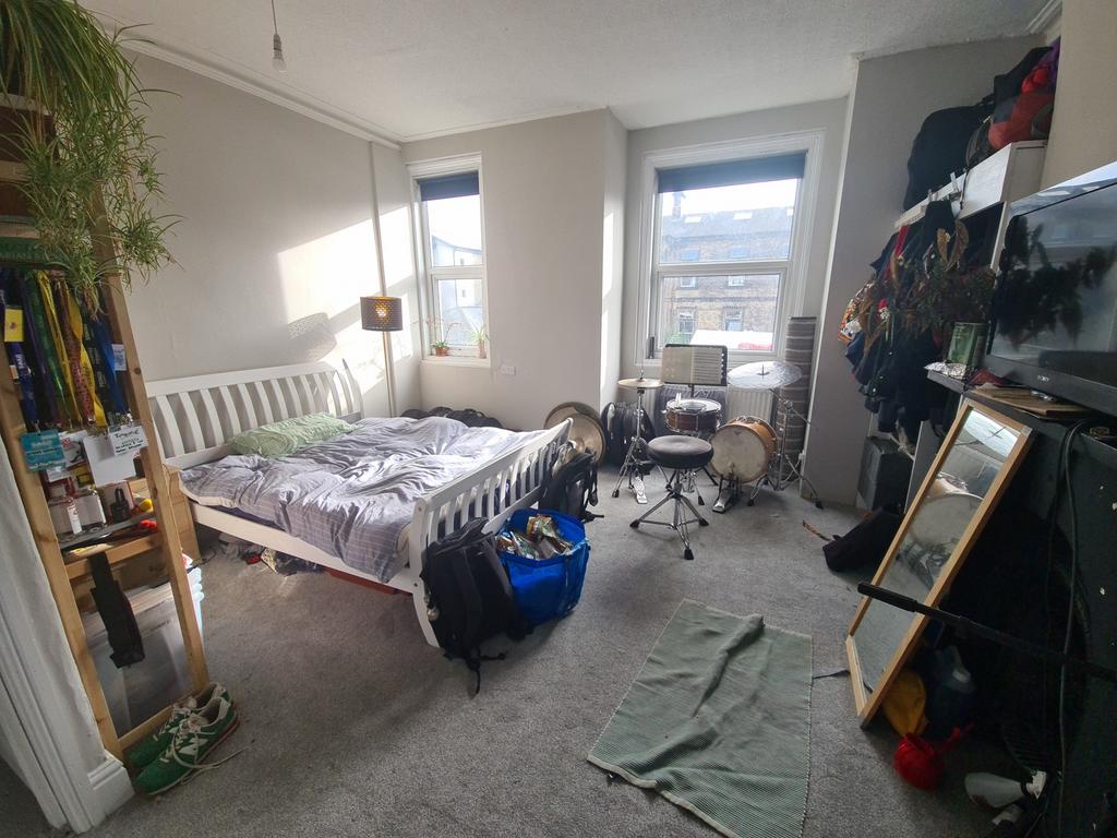 A bright and spacious master bedroom featuring ...