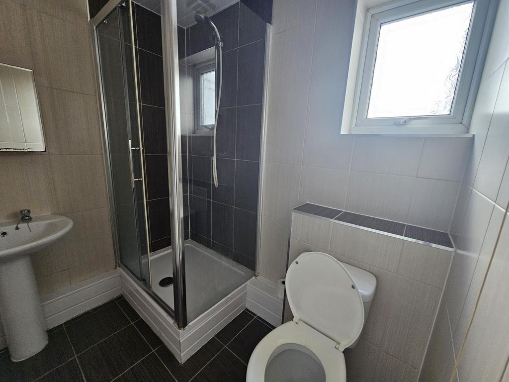 A clean, well-maintained bathroom featuring a s...