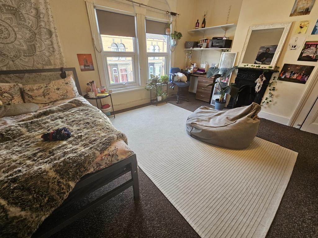 Bright and spacious master bedroom featuring a ...