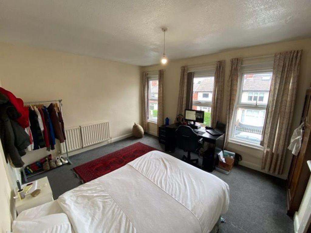A bright and inviting double bedroom featuring ...