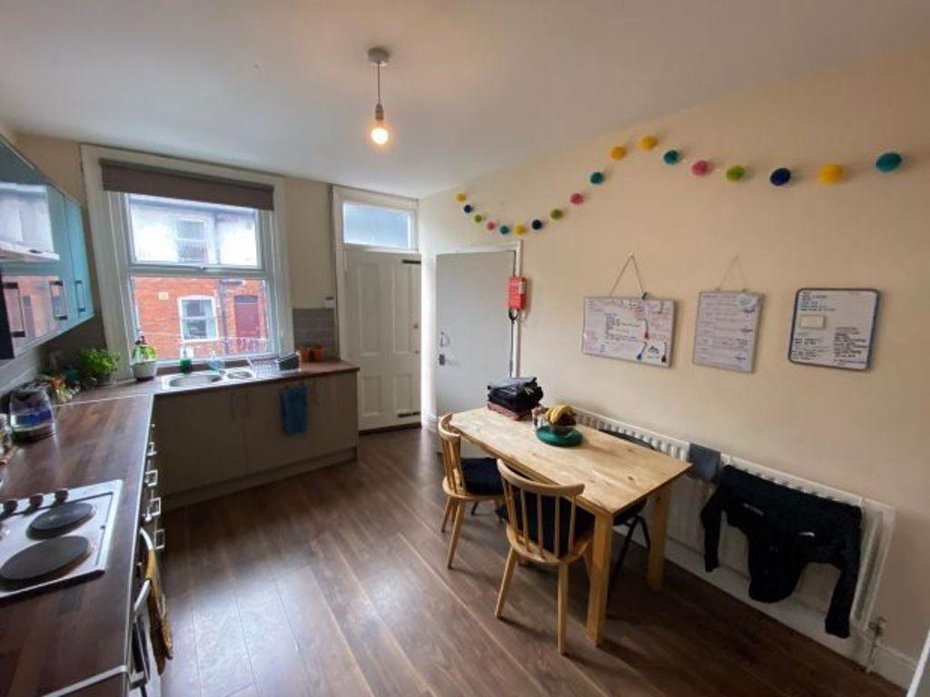 Bright and tidy kitchen with ample natural ligh...