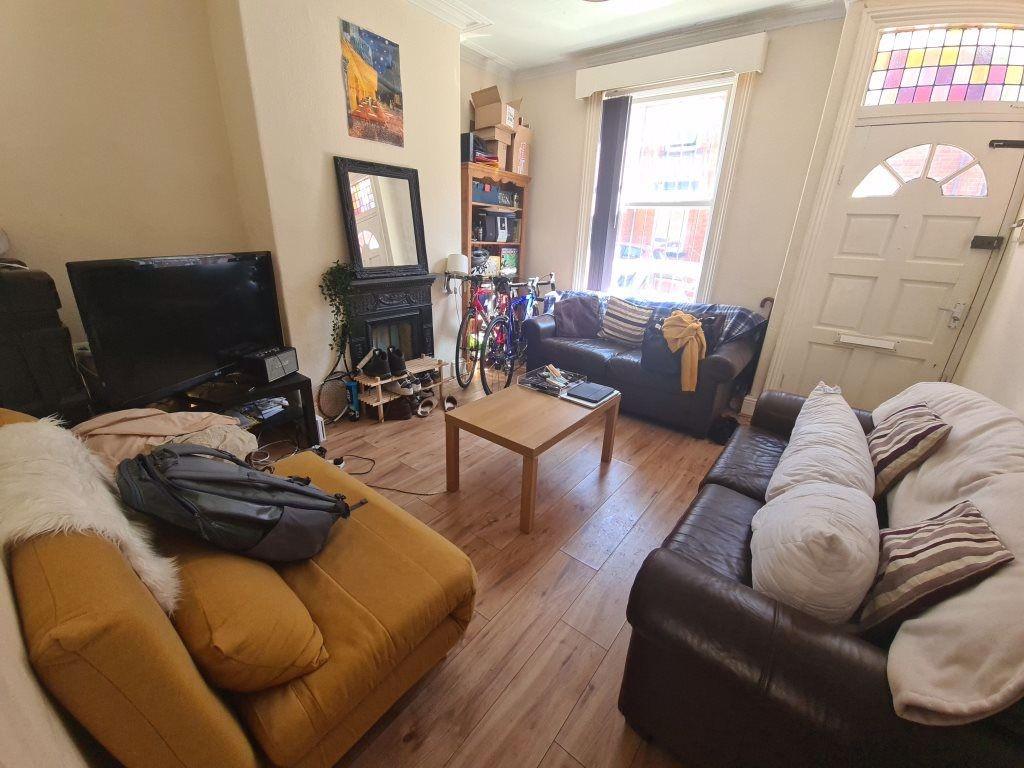 A bright and inviting living room featuring com...