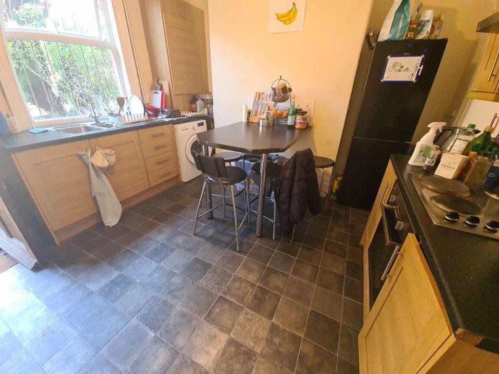 A well-maintained kitchen with natural light st...
