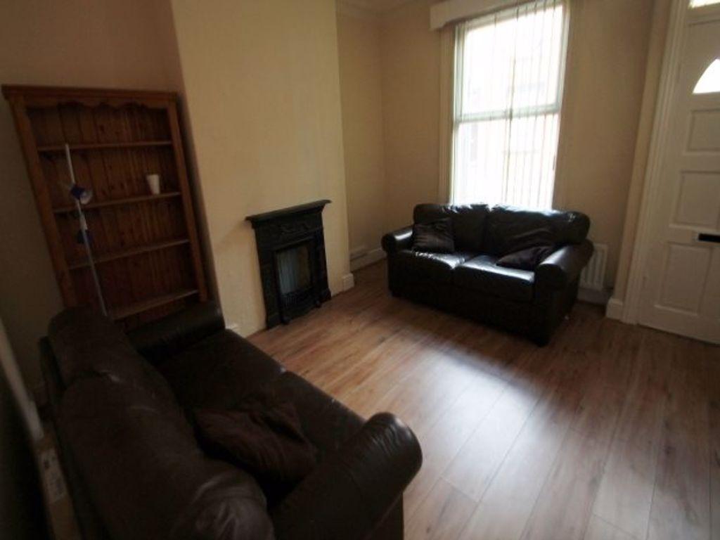 A spacious and cozy living room featuring two d...