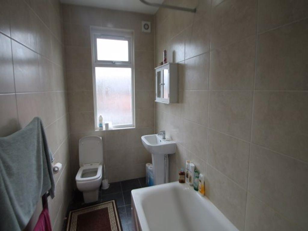 A clean and functional bathroom featuring a bat...