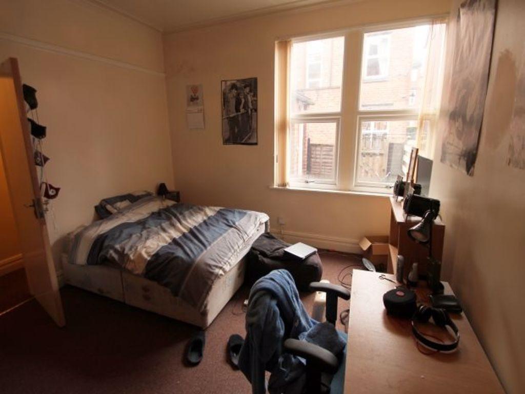 Cozy and functional single bedroom featuring a ...