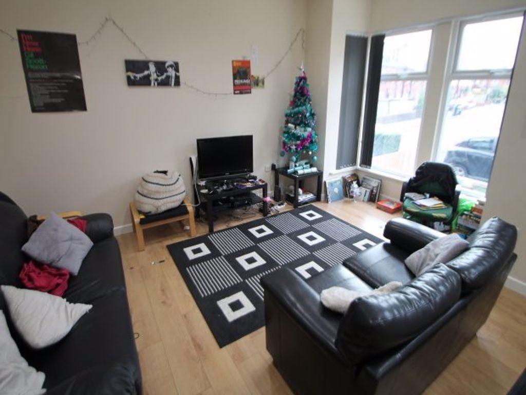 A cozy and inviting living room featuring comfo...