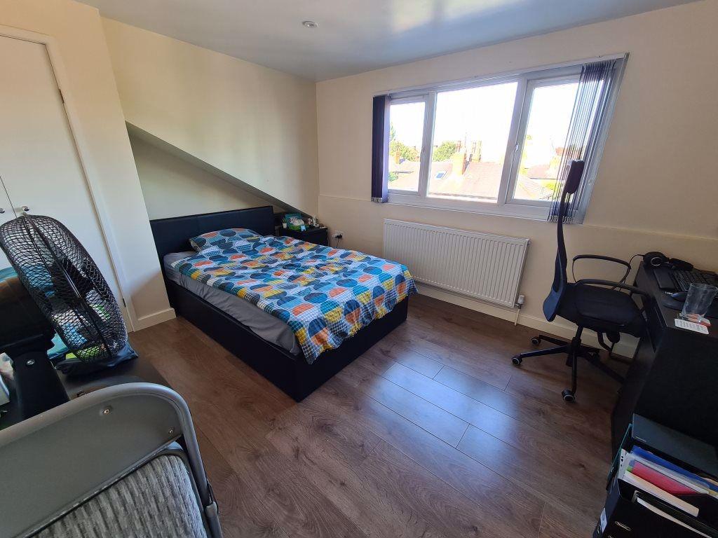 Bright and tidy double bedroom featuring a comf...