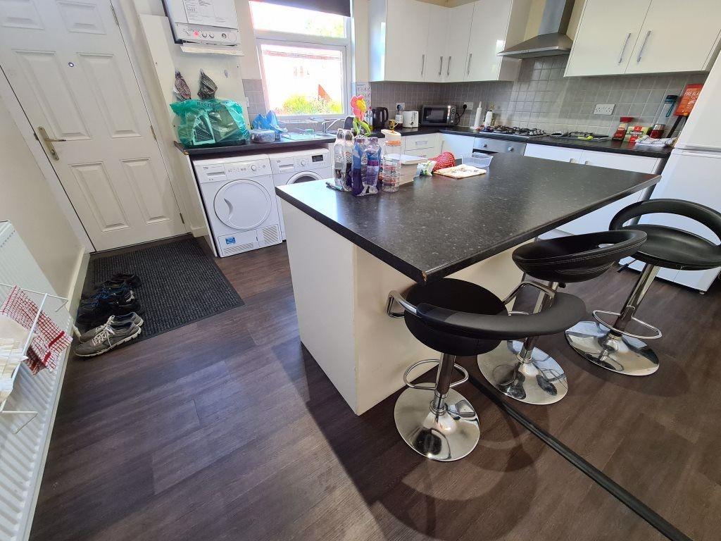 Bright and modern kitchen featuring a spacious ...