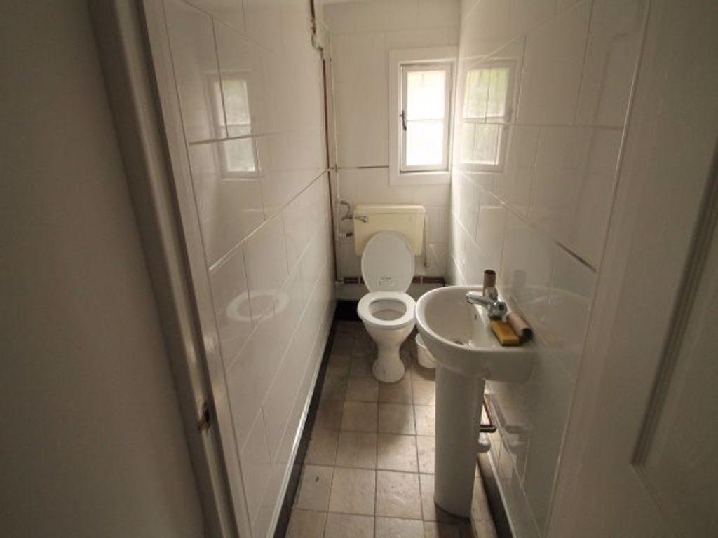 A neat and well-maintained small toilet room wi...