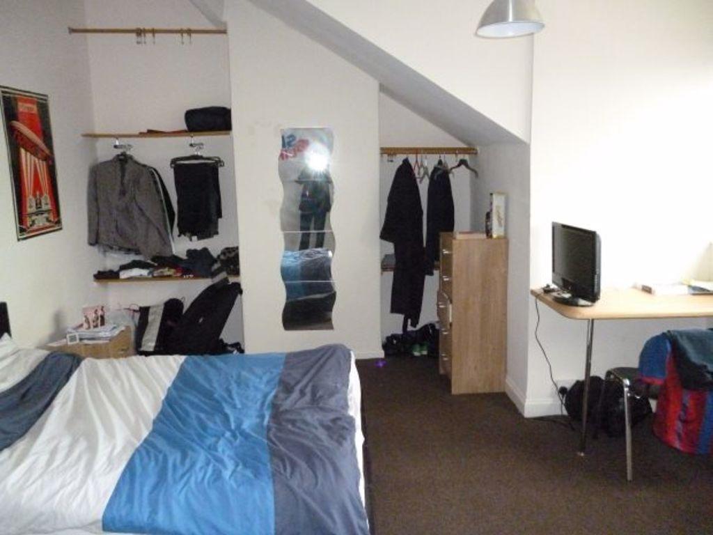 Cozy double bedroom featuring a comfortable dou...